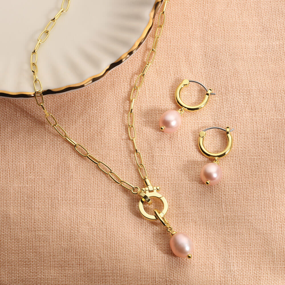 gold plated necklaces and pink pearl earrings