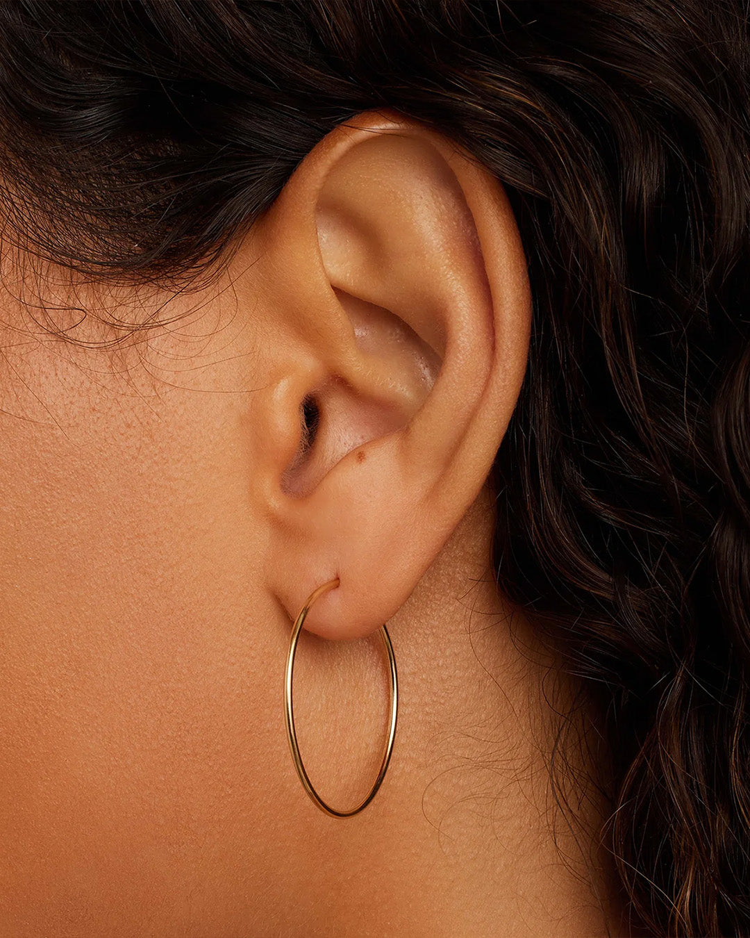 Woman wearing Classic Gold Hoop || option::14k Solid Gold, 30mm